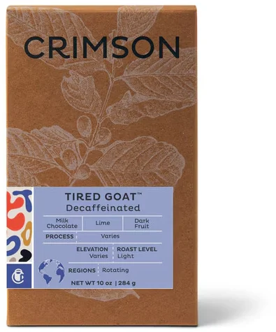 Tired Goat · Decaf — a kraft coffee box with a printed label.